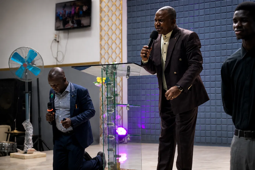 Rev'd Bola Payimo led a moment of fervent prayer over the congregation during the service.